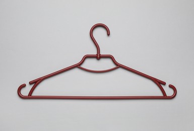 Empty clothes hanger on white background, top view