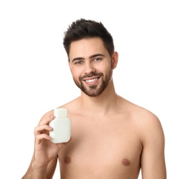Photo of Handsome young man with beard holding post shave lotion on white background