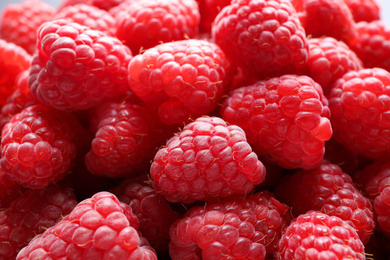 Photo of Fresh sweet ripe raspberries as background, closeup