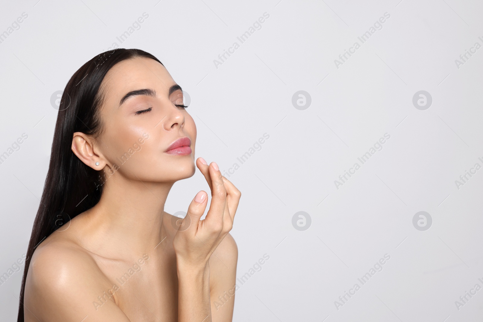 Photo of Portrait of attractive young woman on light grey background, space for text. Spa treatment