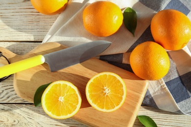 Fresh juicy oranges on wooden background, top view