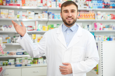 Image of Portrait of professional pharmacist in modern drugstore