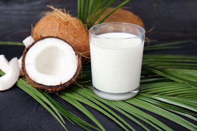 Glass of coconut milk on table