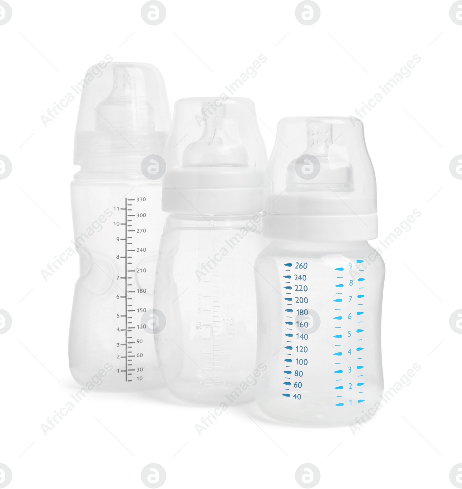 Photo of Three empty feeding bottles for baby milk on white background