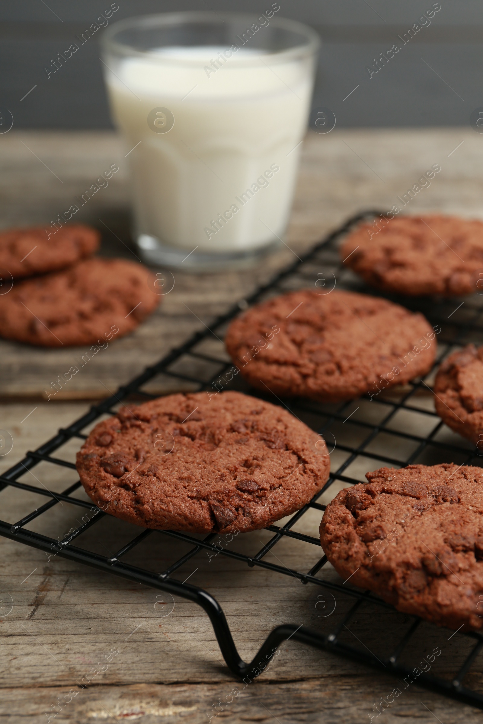 Photo of Delicious chocolate chip cookies on wooden table, closeup