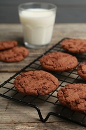 Delicious chocolate chip cookies on wooden table, closeup