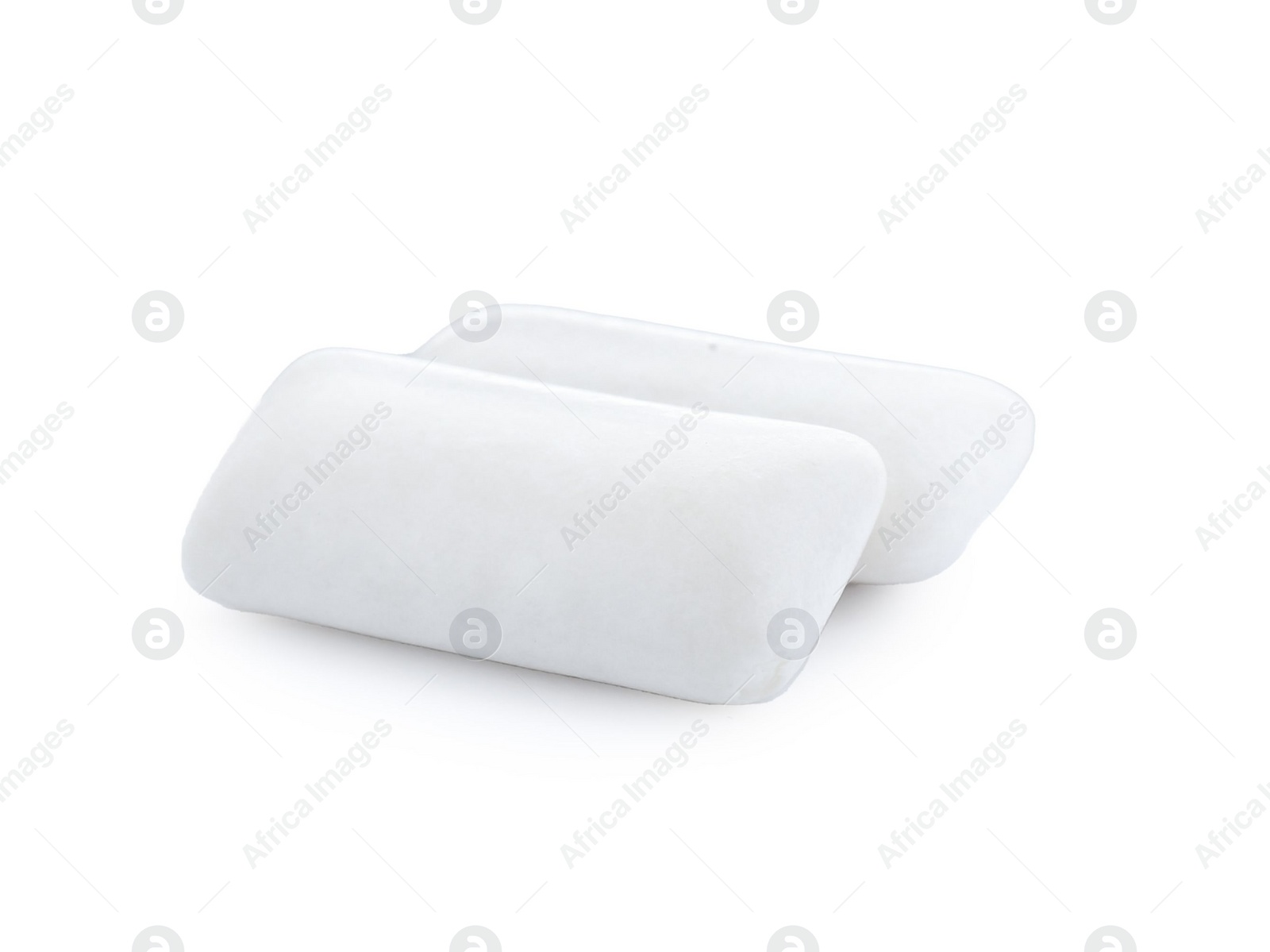 Photo of Two pieces of chewing gum on white background