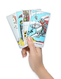 Woman holding tarot cards on white background, closeup