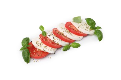 Photo of Tasty salad Caprese with mozzarella, tomatoes, basil and spices on white background