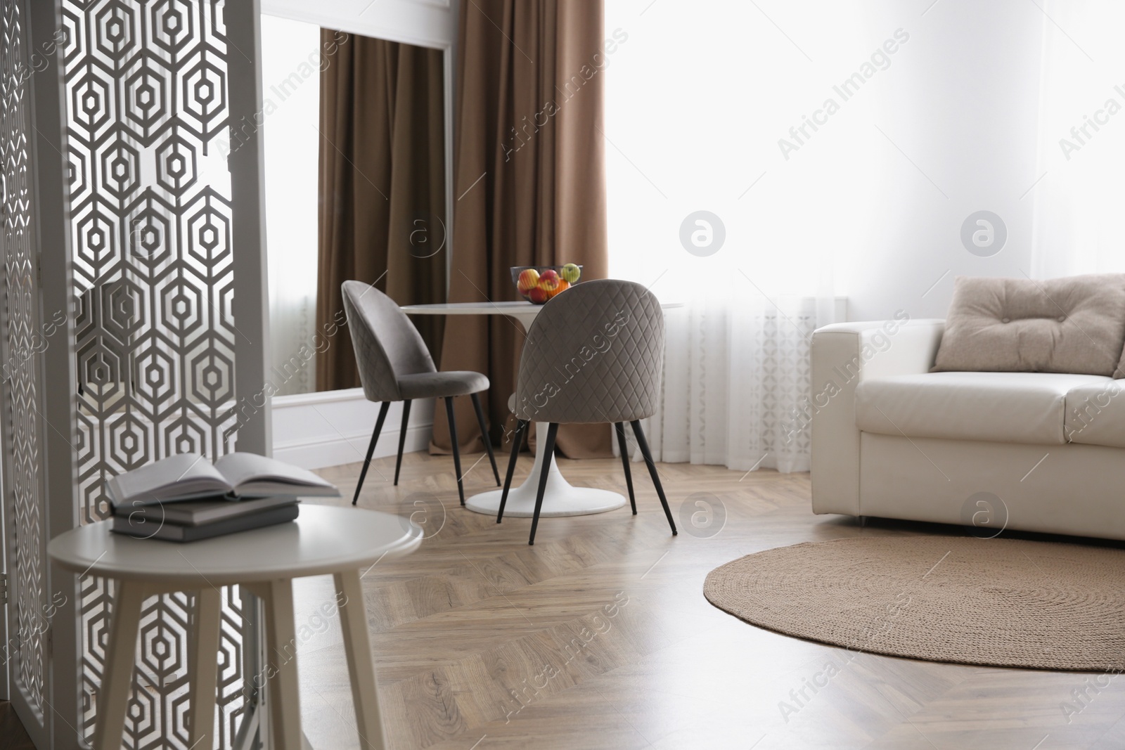 Photo of Modern living room with parquet floor and stylish furniture