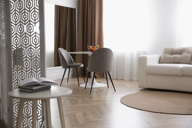 Photo of Modern living room with parquet floor and stylish furniture