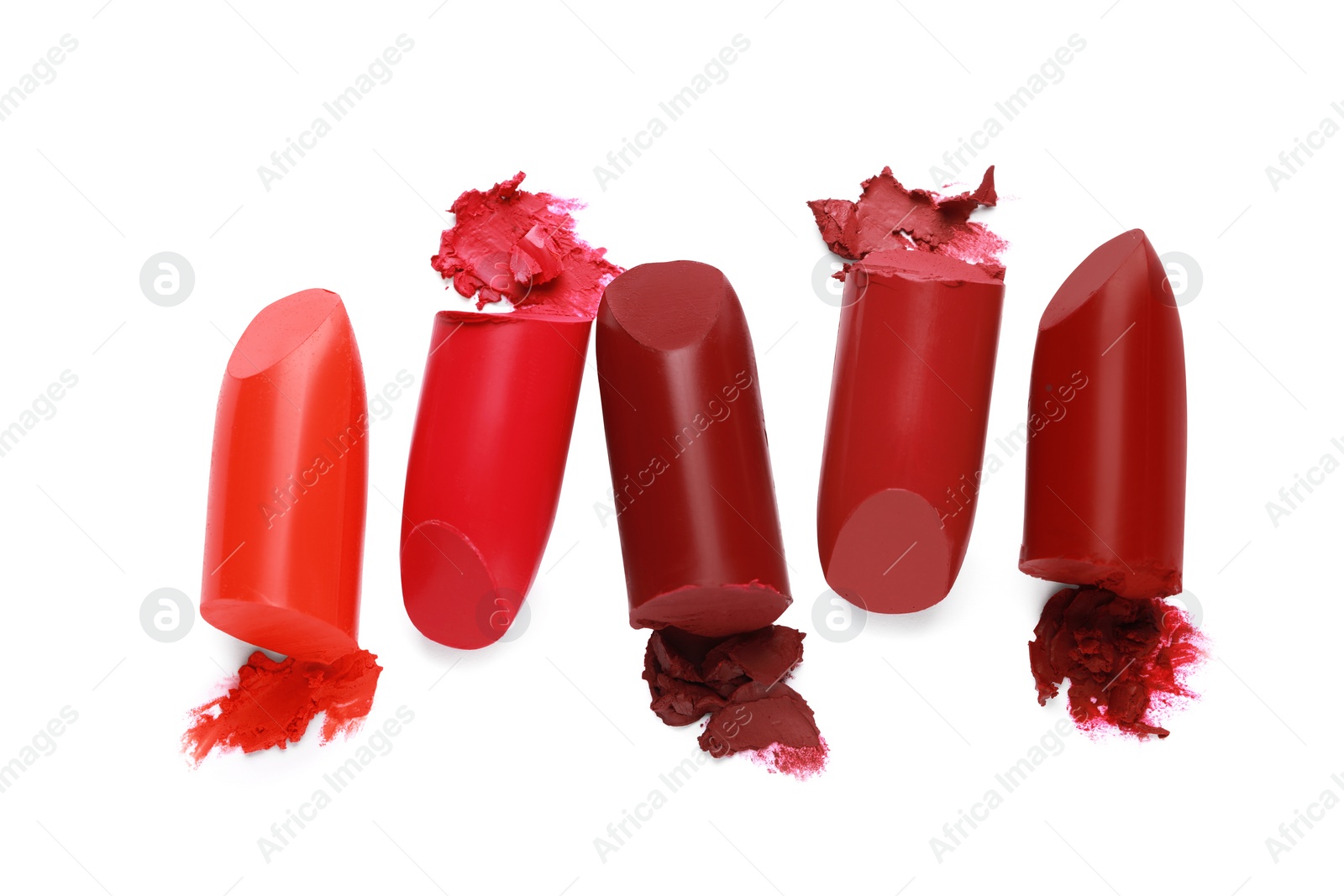 Photo of Different bright lipsticks on white background, top view