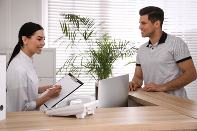 Nurse and patient at reception in hospital