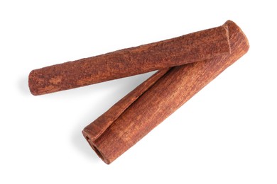 Photo of Cinnamon sticks isolated on white, top view