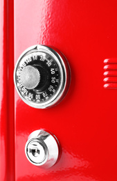 Red steel safe with mechanical combination lock, closeup