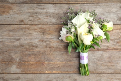 Bouquet of beautiful fragrant flowers on wooden background