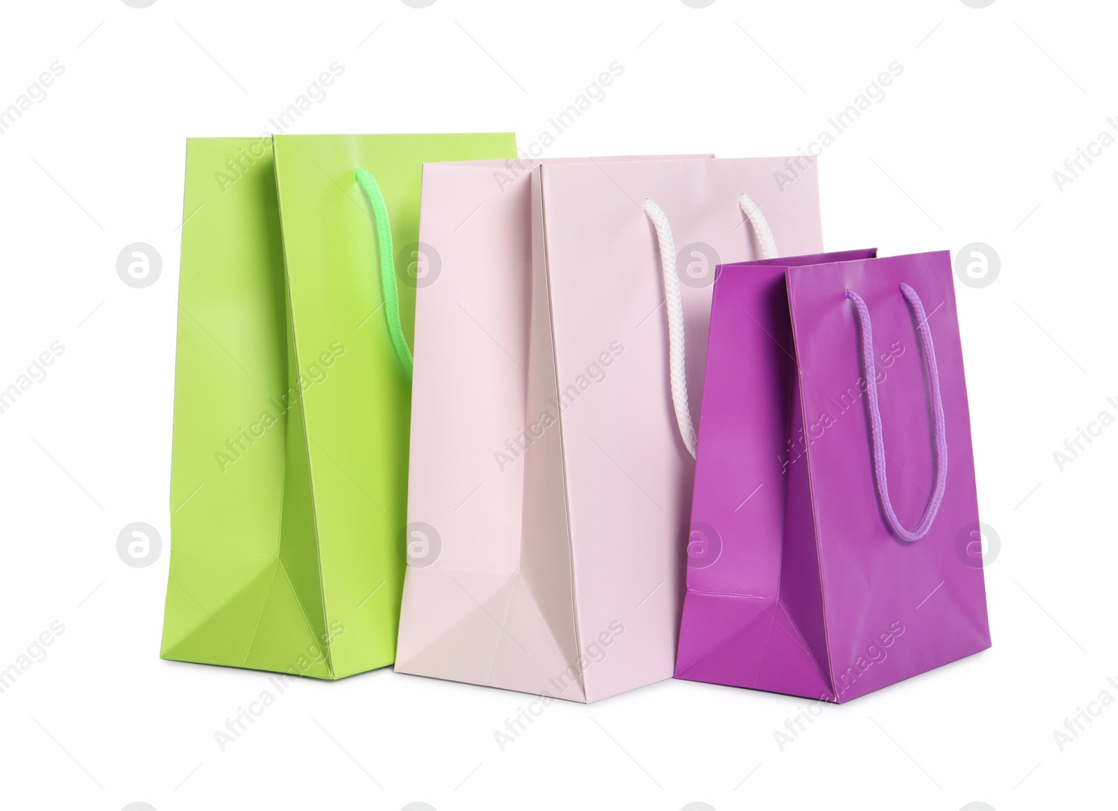 Photo of Colorful paper shopping bags isolated on white