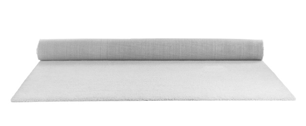 Photo of Rolled soft carpet on white background. Interior element