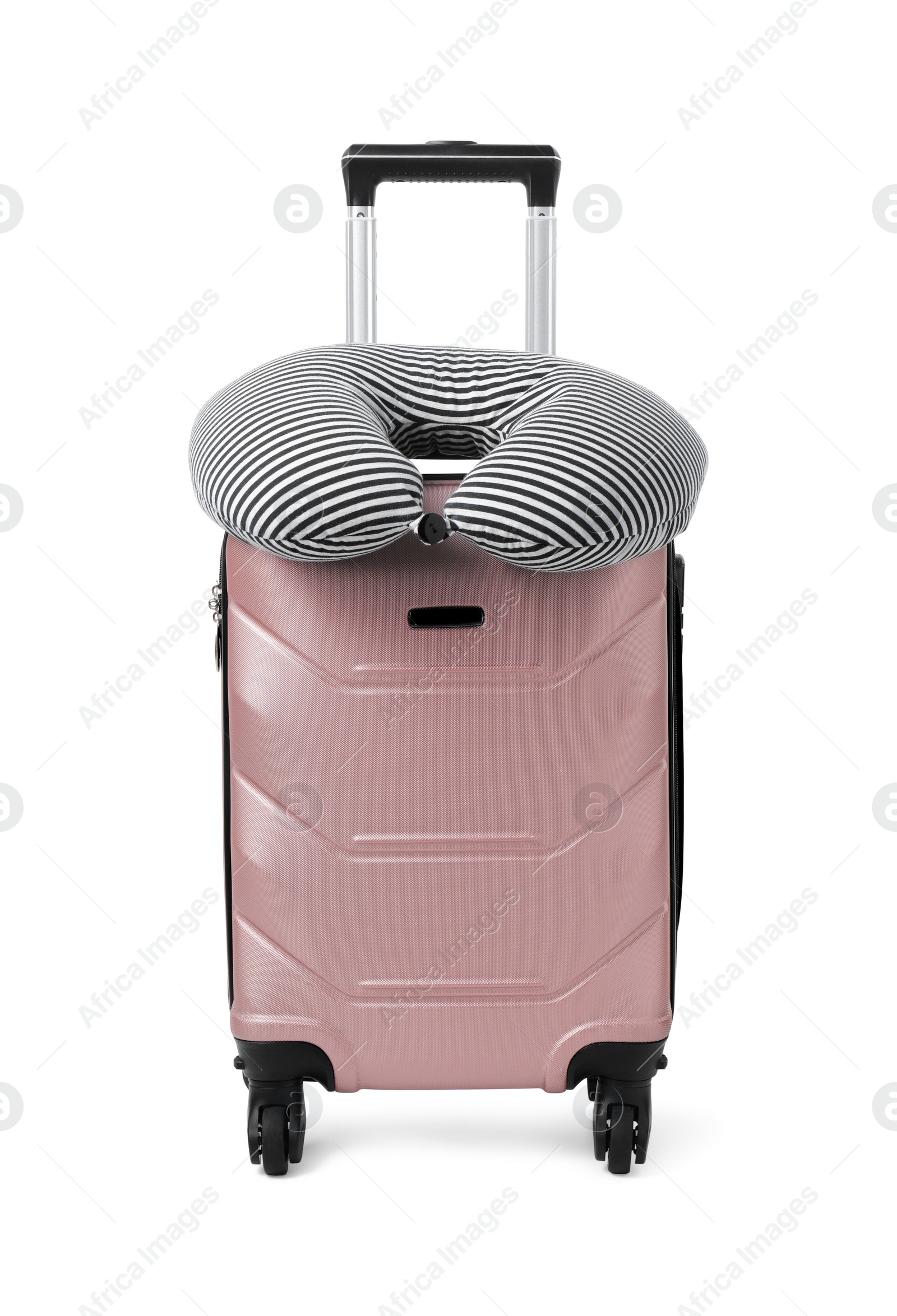 Photo of Soft travel pillow on suitcase isolated on white