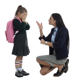 Photo of Teacher pointing on wrist watch while scolding pupil for being late against white background