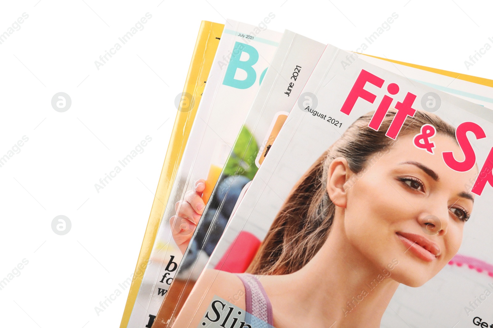 Photo of Stack of different magazines on white background, closeup