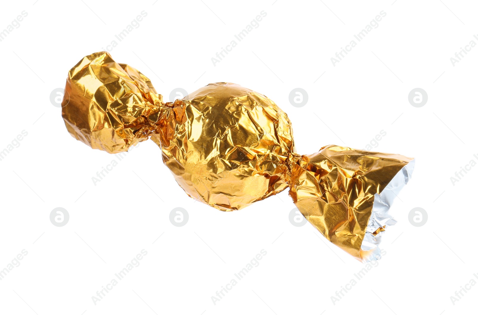 Photo of Tasty candy in yellow wrapper isolated on white