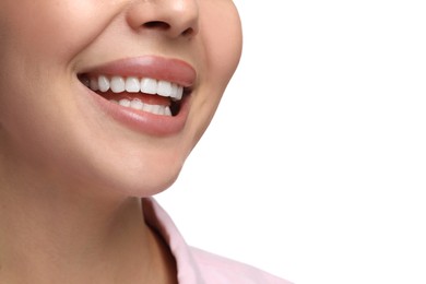 Woman with clean teeth smiling on white background, closeup