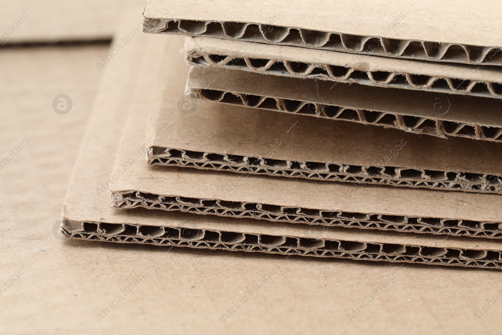 Photo of Sheets of brown corrugated cardboard, closeup view