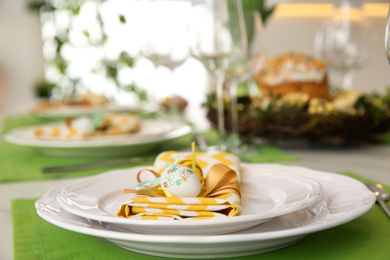 Festive Easter table setting with eggs, closeup