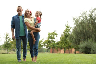 Happy family spending time together in park on sunny summer day