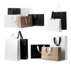 Image of Set with different paper shopping bags on white background