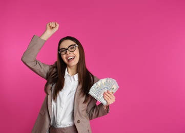 Businesswoman with money on color background. Space for text