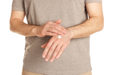 Photo of Man applying cream onto hand against white background, closeup