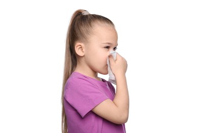 Sick girl blowing nose in tissue on white background. Cold symptoms