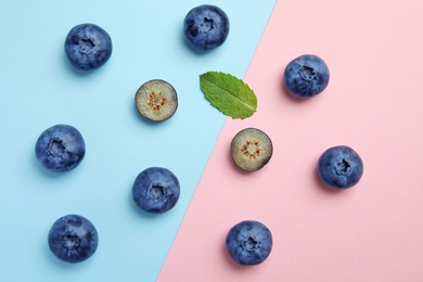 Photo of Flat lay composition with tasty blueberry on color background