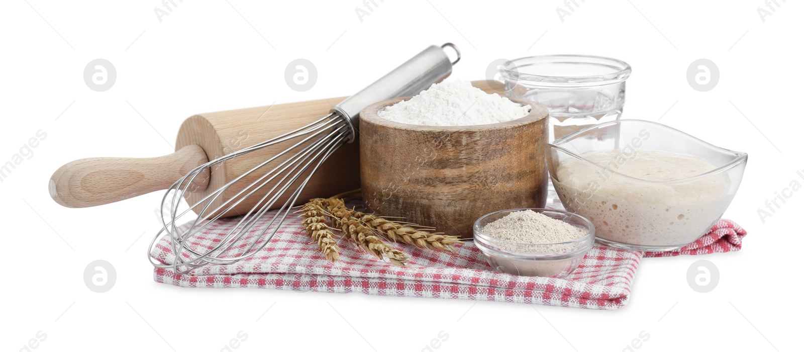 Photo of Leaven, flour, water, rolling pin, whisk and ears of wheat isolated on white