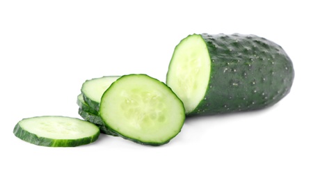 Photo of Fresh green sliced cucumber on white background