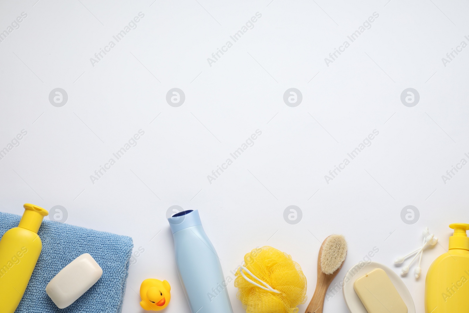 Photo of Baby bath accessories and care products on white background, flat lay. Space for text