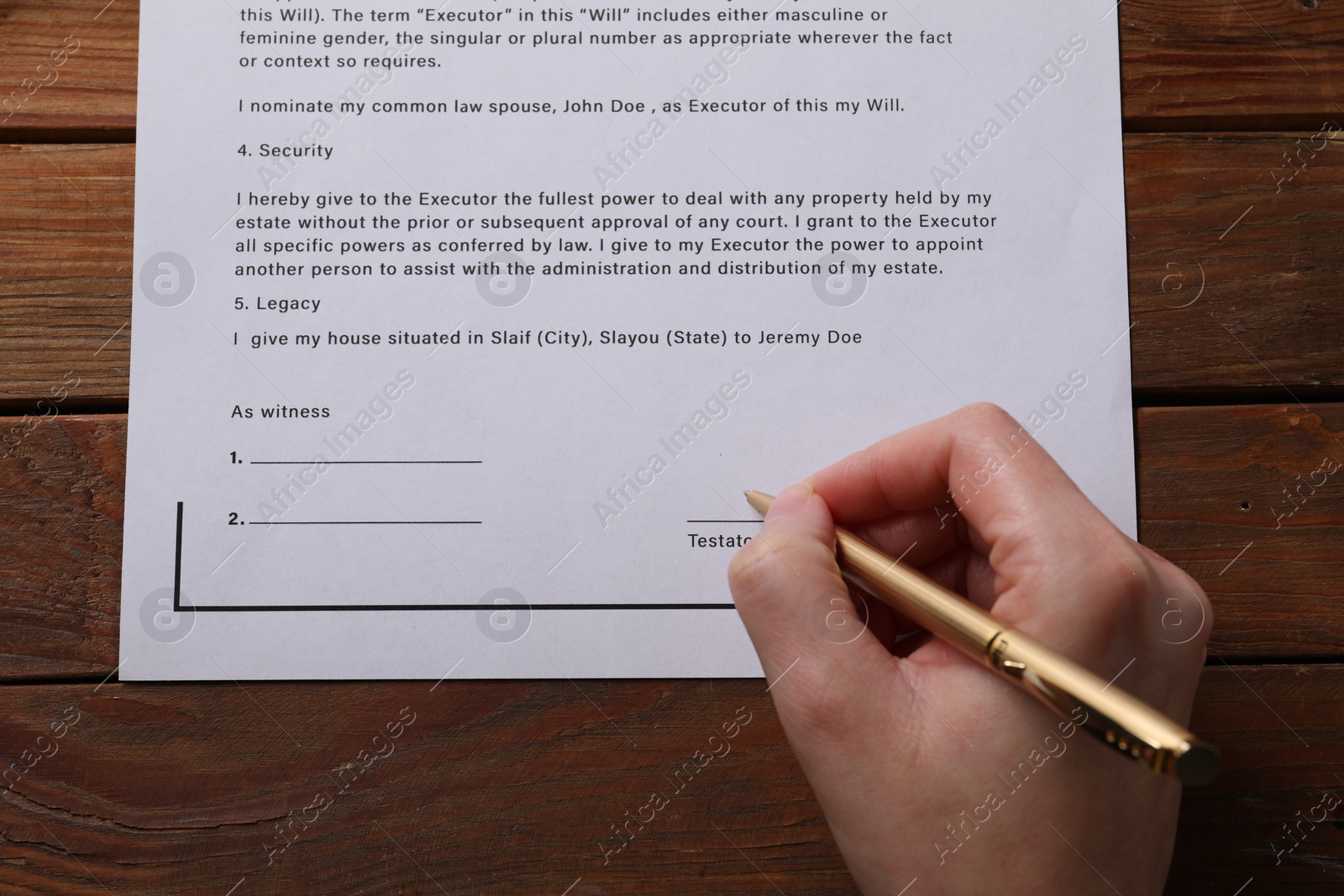 Photo of Woman signing Last Will and Testament at wooden table, top view