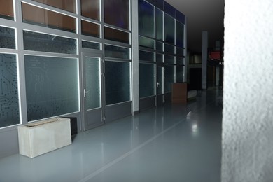 Photo of Modern empty office corridor with glass wall