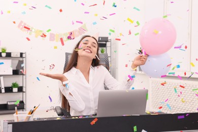 Photo of Young woman having fun during office party at workplace
