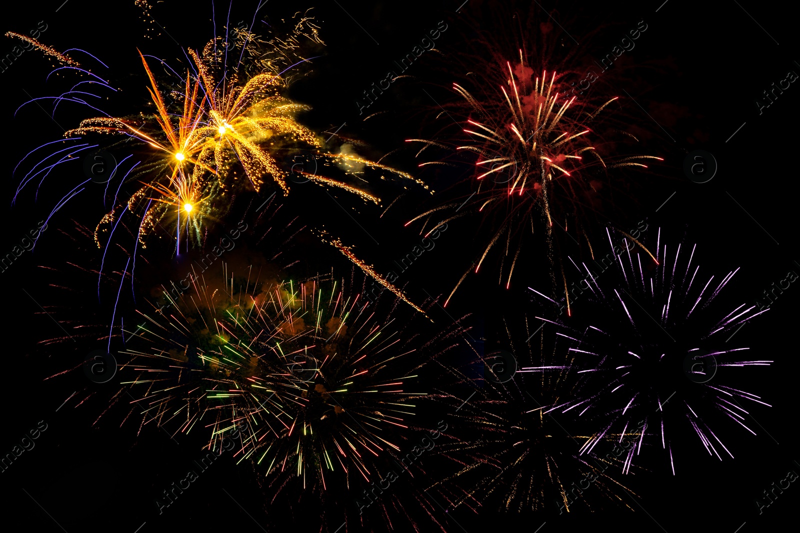 Image of Beautiful bright fireworks lighting up night sky