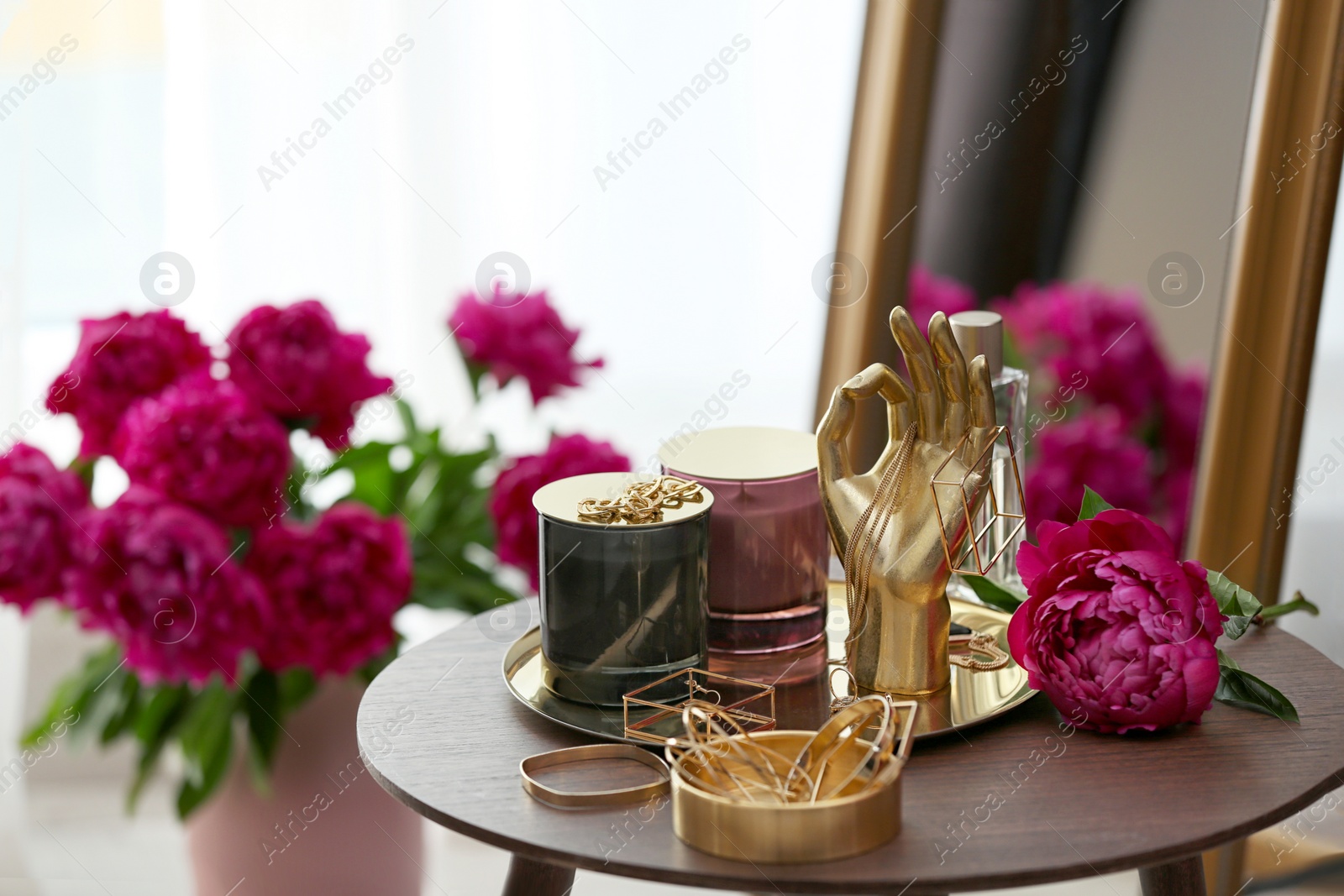 Photo of Composition with stylish accessories and interior elements on table indoors