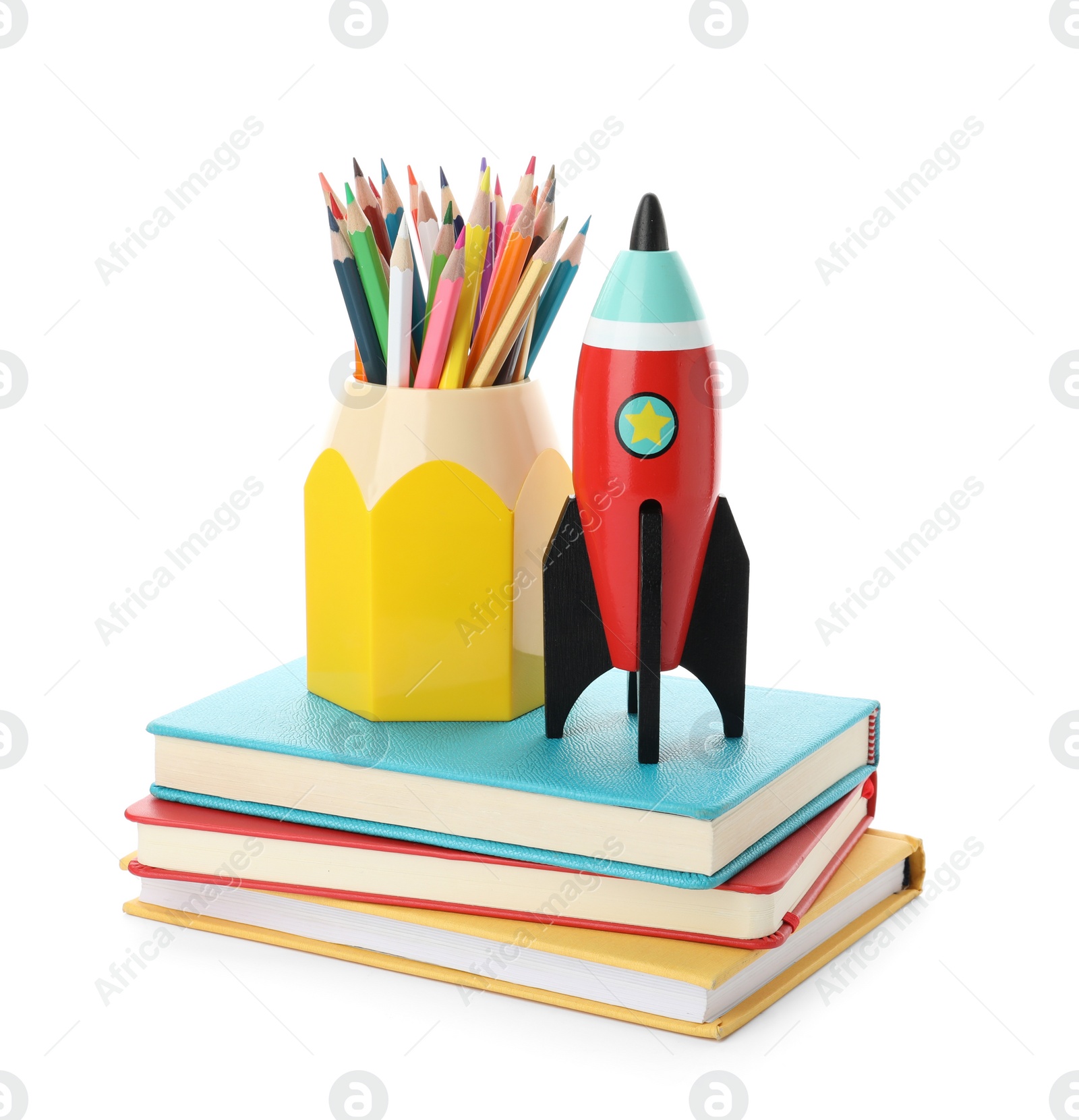 Photo of Bright toy rocket and school supplies on white background