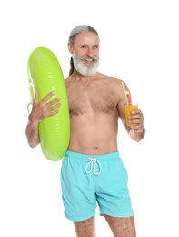 Shirtless man with inflatable ring and glass of cocktail on white background