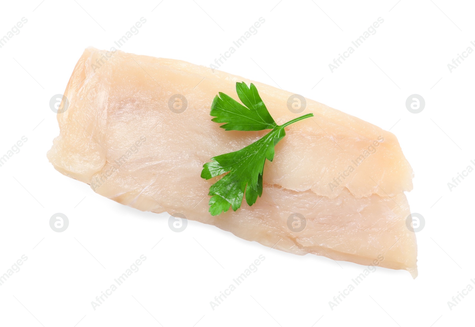 Photo of Piece of raw cod fish and parsley isolated on white, top view