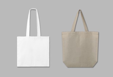 Image of Textile eco bags on light grey background, collage. Mock up for design