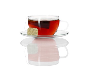 Brewing aromatic tea. Cup with teabag isolated on white