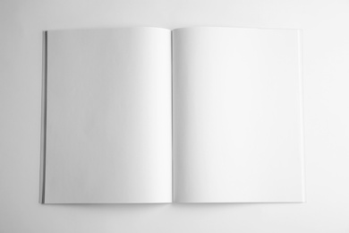 Photo of Blank open book on white background, top view. Mock up for design