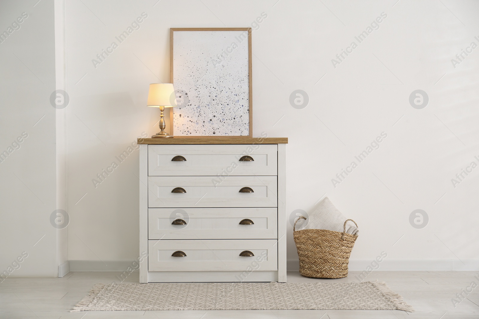 Photo of Stylish chest of drawers in living room interior